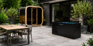 sauna and cold plunge tub outside on the concrete patio